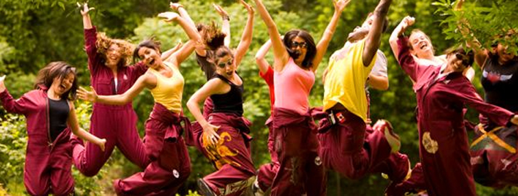 Photo of a group of students jumping in the air